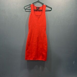 Orange form fitting dress. Super stretchy. Xs that will fit up to an xl.